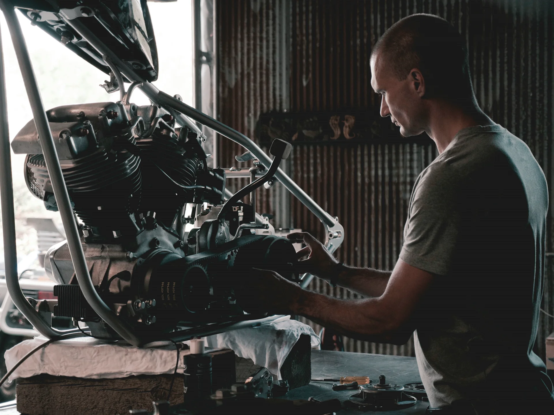 Professional mechanic working on a car in a modern workshop
